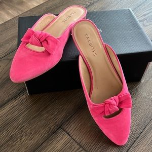 Adorable pink suede mules with bow on toe.